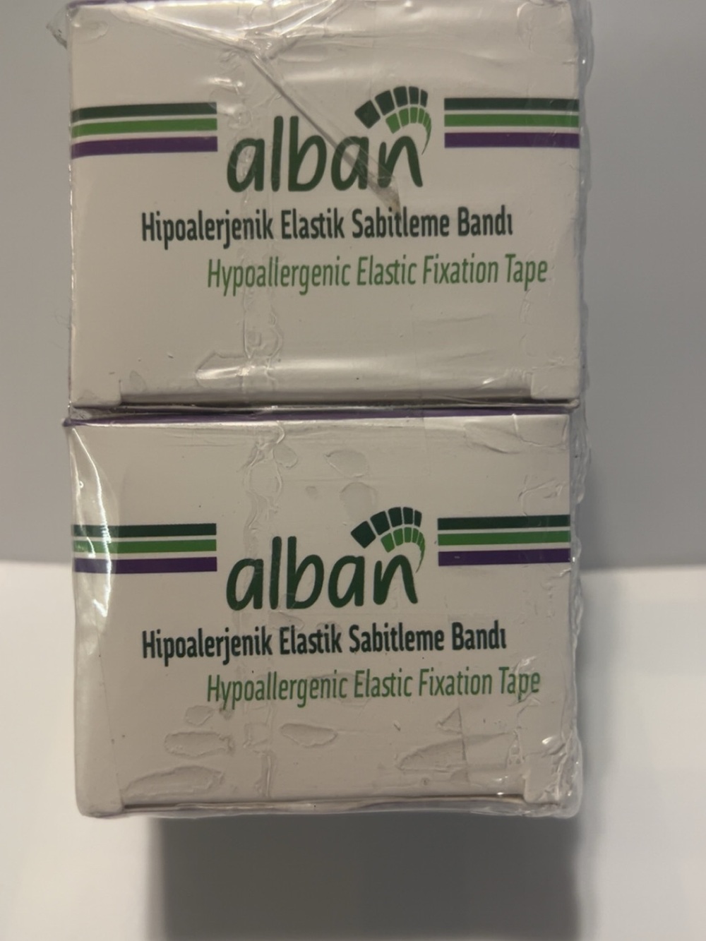 Alba Hypoallergenic Elastic Fixation Tape - White with Green & Purple Accents